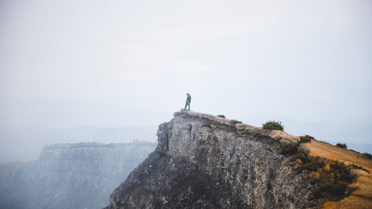 Where Your Treasure Lies - Man standing on cliff edge